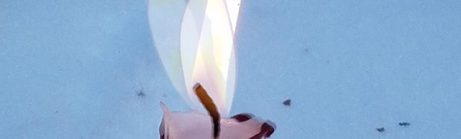 closeup of flame on lit candle